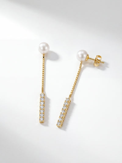 Ocean Breeze long chain dangle earrings in 14K gold with freshwater pearl