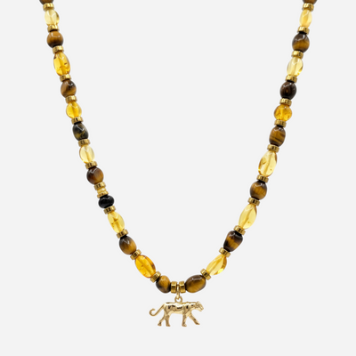 Beaded necklace with amber and tiger eye stones and gold panther charm