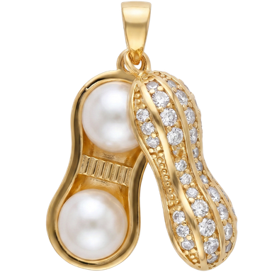 Gold-toned brass peanut charm pendant with organic shape in warm natural light
