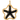 Black enamel starfish gold plated charm pendant styled on a light surface in natural light