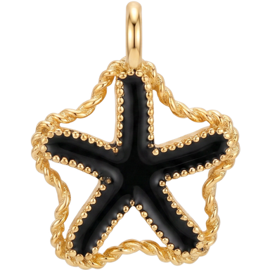 Black enamel starfish gold plated charm pendant styled on a light surface in natural light