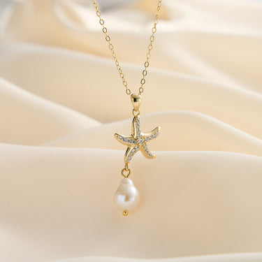 Starfish pearl necklaces displayed in gold.