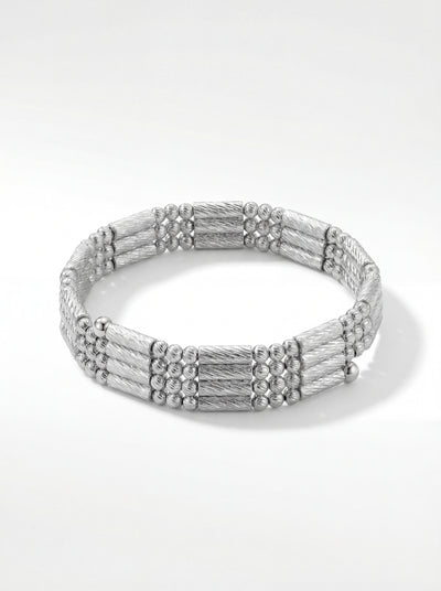 Rhodium silver magnetic chain bracelet on wrist in natural daylight