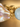 Close-up of baroque pearl, gold wire wrap connector, and pale blue chalcedony bead