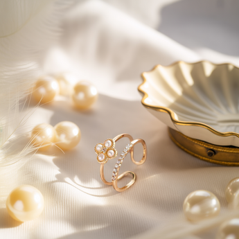 Golden bloom double layer adjustable ring with pearls on a soft fabric background