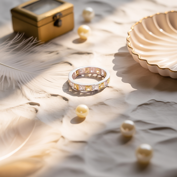 golden hour band ring and a decorative box on a marble surface