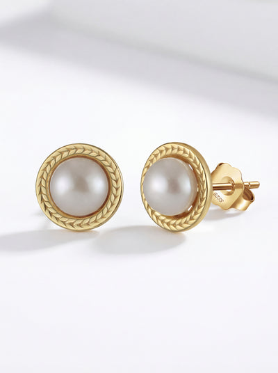 Golden Shore Stud Earrings with cultured freshwater pearl in braided gold frame
