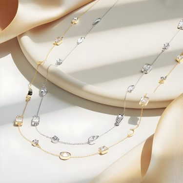 Side-by-side display of Lumière Necklace in gold and silver finishes.