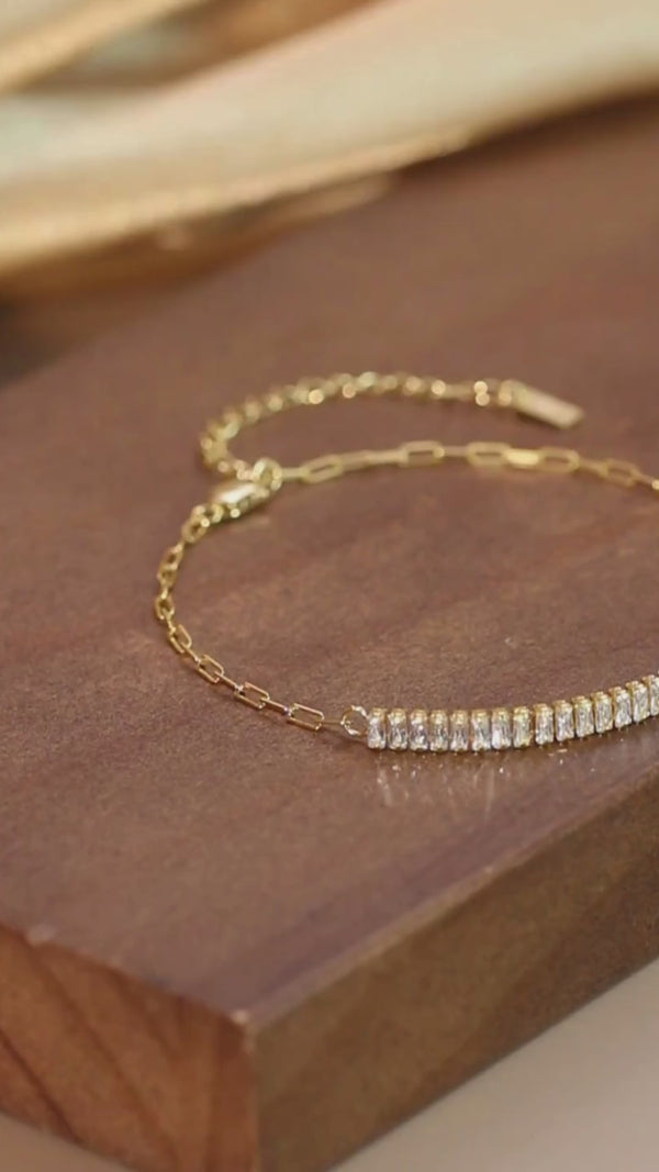 14k Gold plated 925 Sterling Silver CZ bracelet flatlay on soft surface.