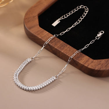 Close-up of silver radiant bar chain link bracelet with cubic zirconia.