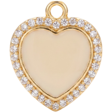 Creamy gold enamel heart charm pendant lifestyle shot in warm natural light
