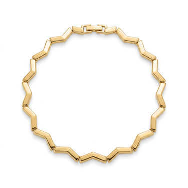 Keys Geometry zigzag gold bangle bracelet styled on wrist in coastal light