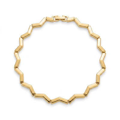 Keys Geometry zigzag gold bangle bracelet styled on wrist in coastal light