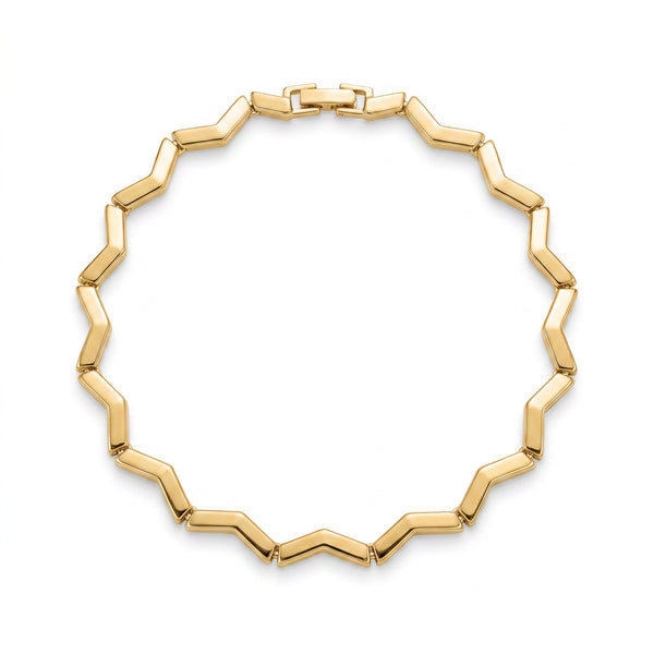 Keys Geometry zigzag gold bangle bracelet styled on wrist in coastal light